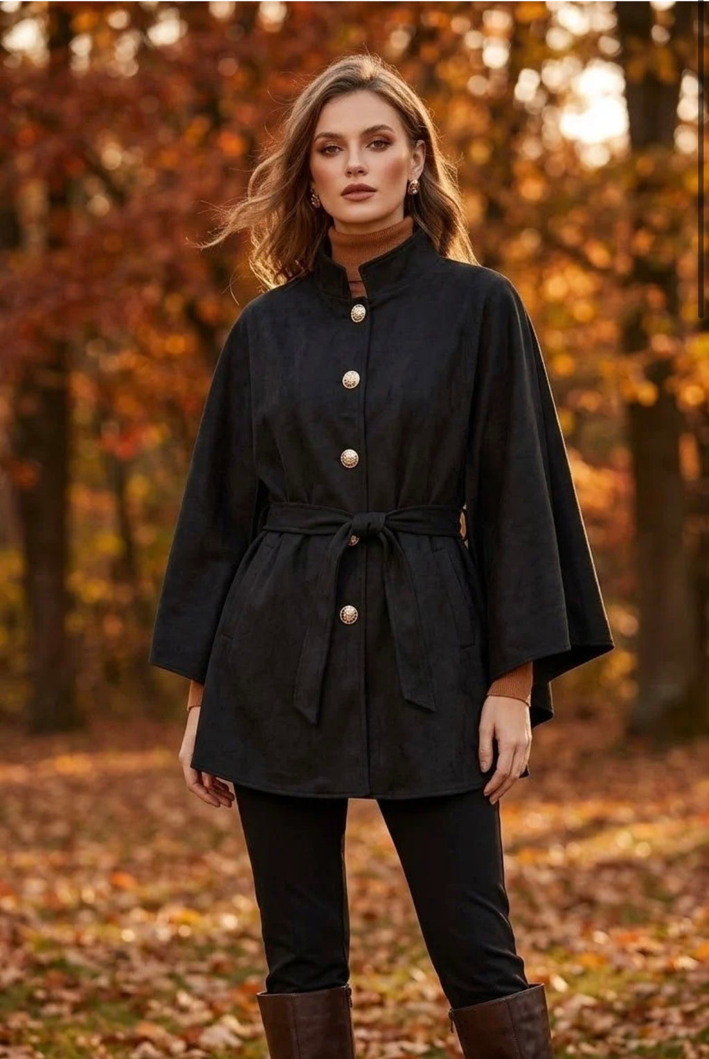 Maria Stunning soft suedette cape with military buttons. 
One size fits 10-22