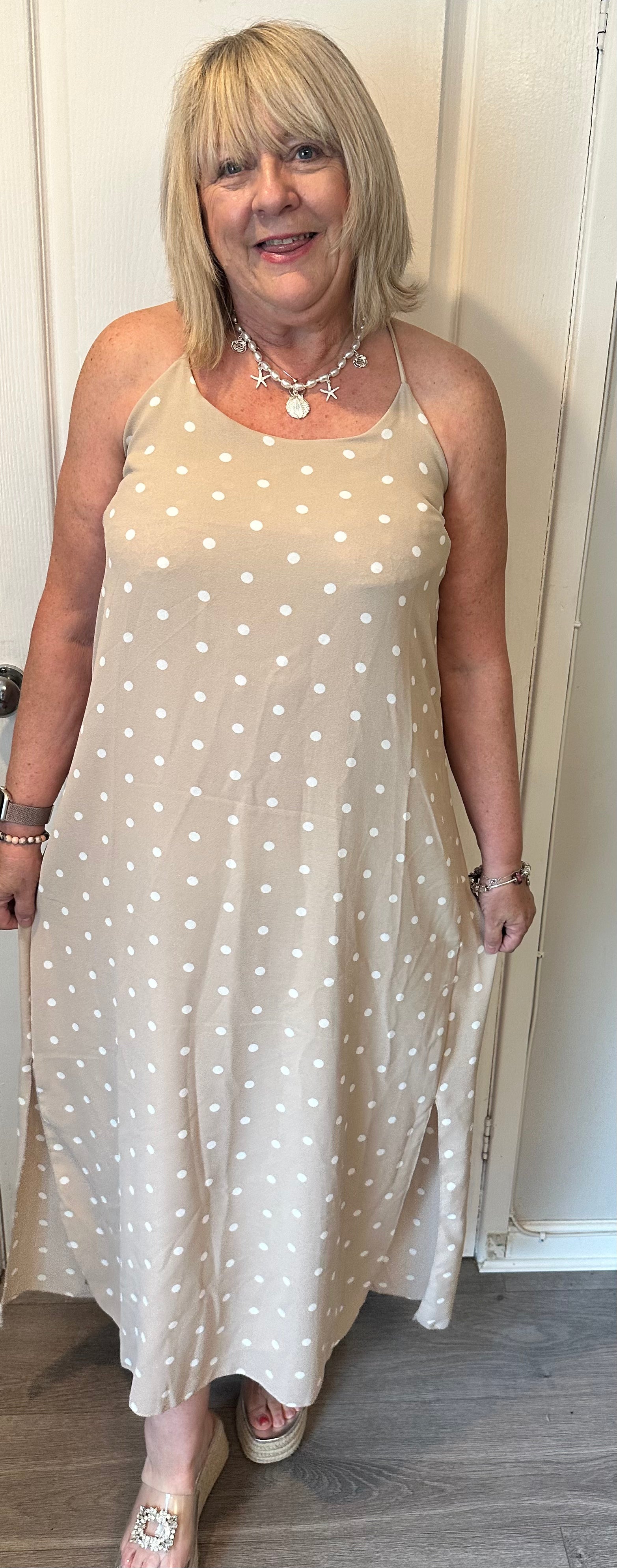 Milan beautiful  soft non crease cami dress with stretch back and side splits. 

One size fits 10-16/18

Polyester elastane
