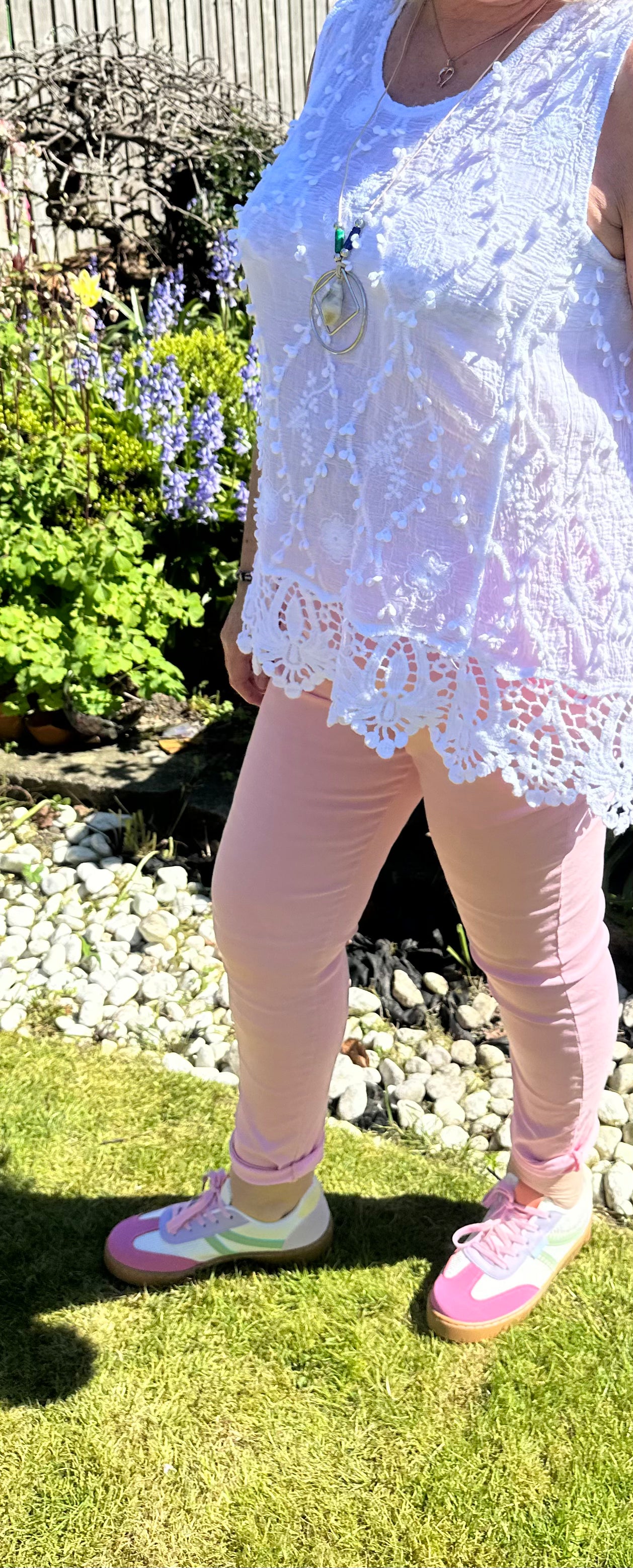 Saffron embroidered appliqué pom pom top with crochet hem. 10-18